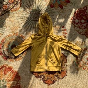 Golden yellow sweatshirt.